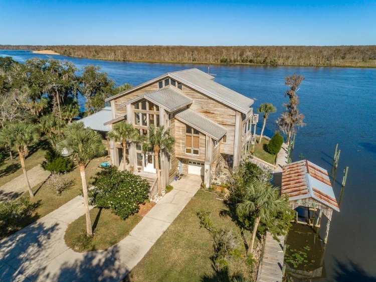 Experience River Living at its Finest at this Dream Cypress Retreat